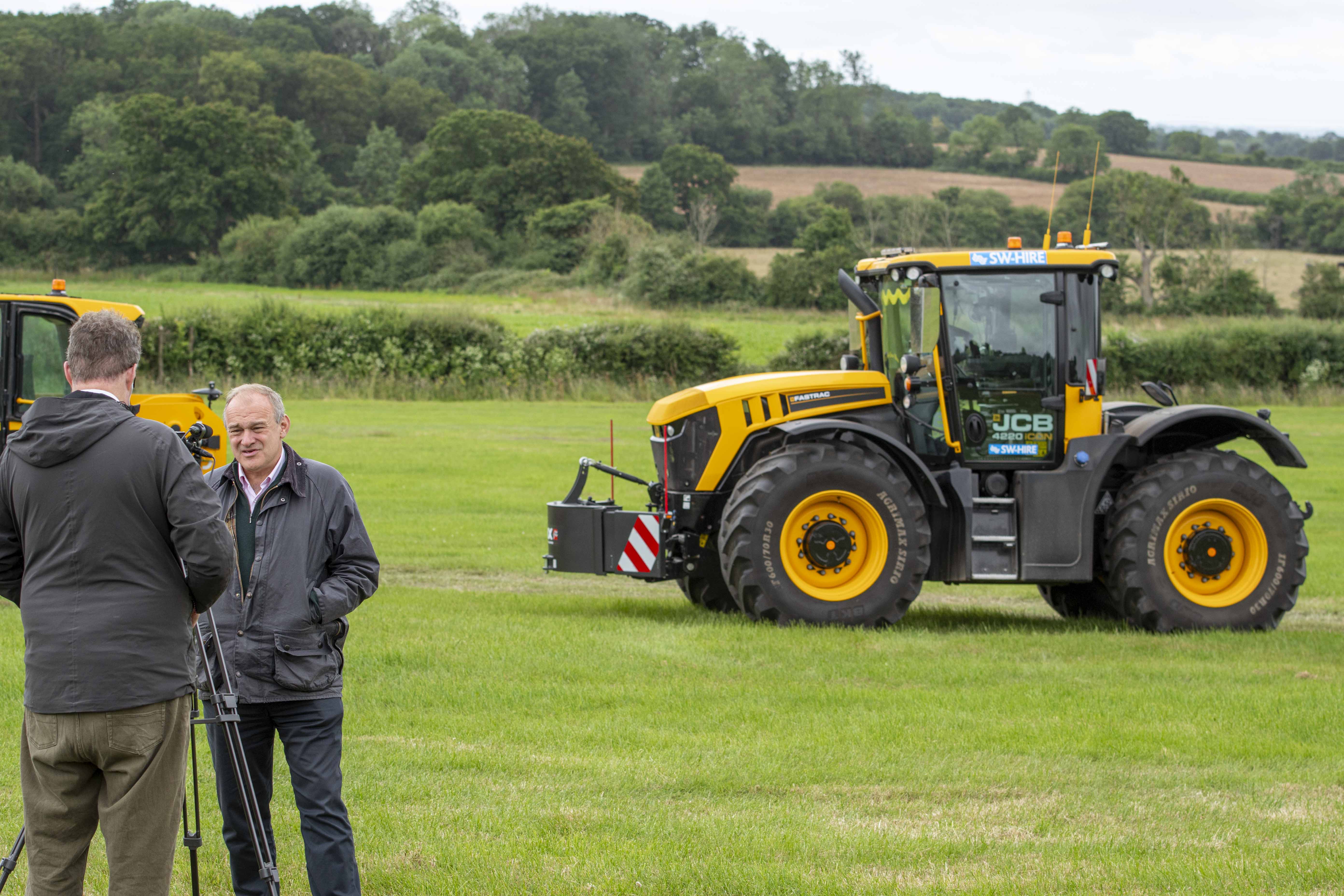 Liberal Democrat Leader, Sir Ed Davey undergoing n interview in front of SW Hire's JCB fastrac tractor